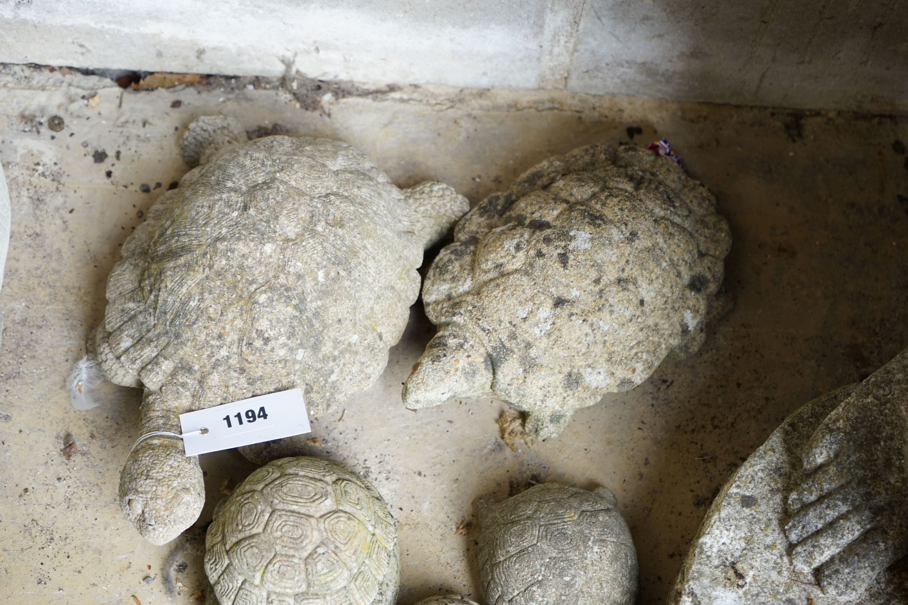 Five reconstituted stone tortoise garden ornaments, largest length 28cm